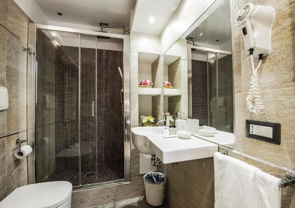 Shower, rainfall showerhead, designer toiletries, hair dryer