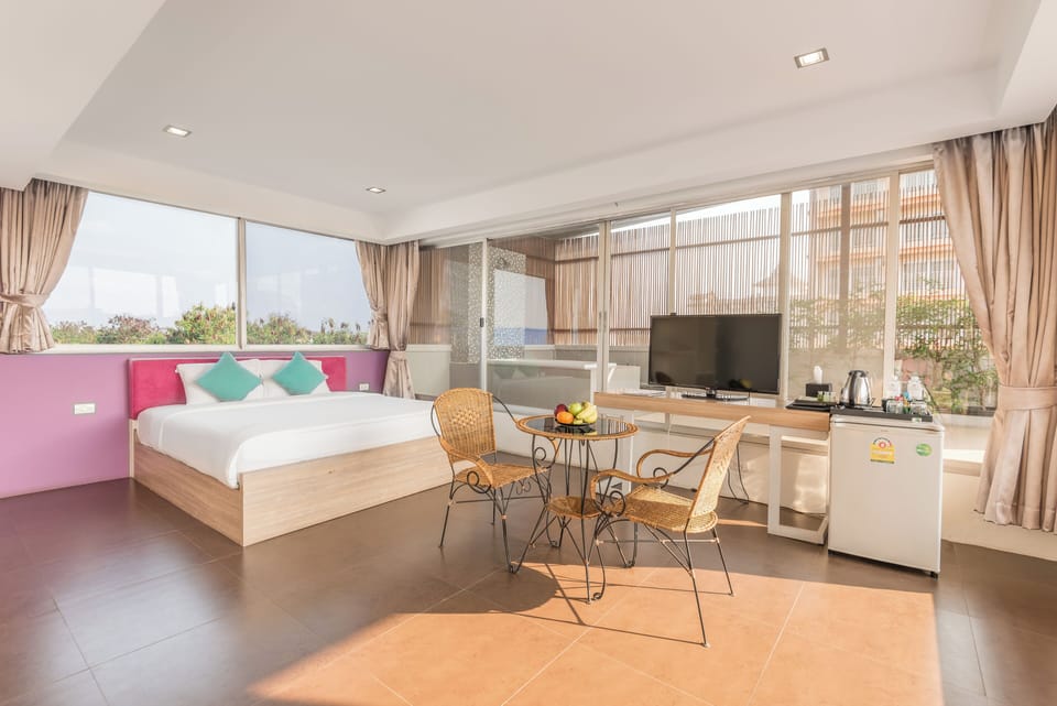 Family Double Room, 1 Bedroom, Non Smoking, Pool View | Minibar, in-room safe, individually decorated, individually furnished