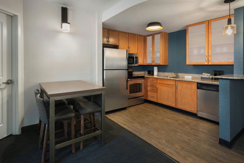 Suite, 2 Bedrooms | Private kitchen | Fridge, microwave, stovetop, dishwasher