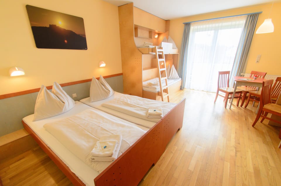 Quadruple Room, Balcony | In-room safe, desk, free WiFi, bed sheets