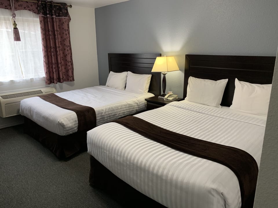 Room, 2 Queen Beds | Pillowtop beds, desk, WiFi (free), bed sheets