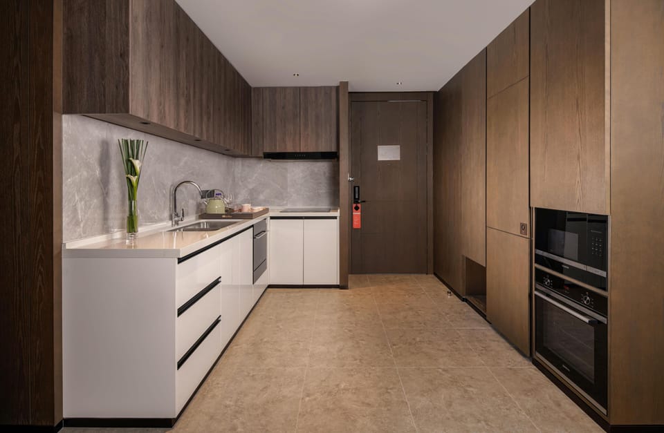 Suite, 2 Bedrooms | Private kitchen | Mini-fridge, cleaning supplies, paper towels