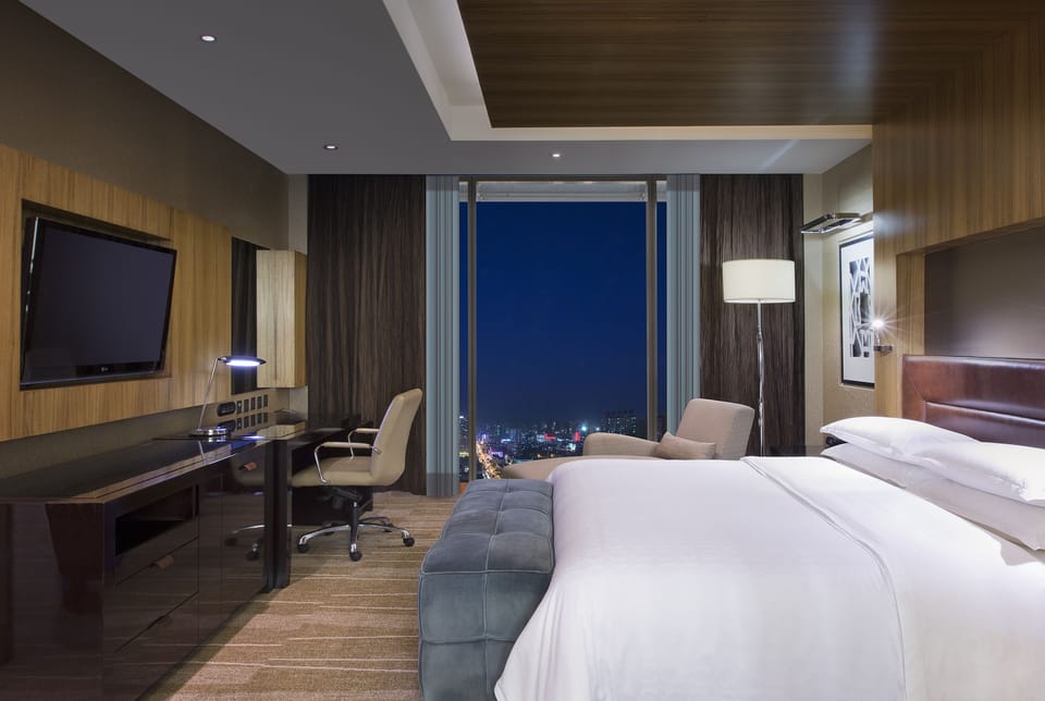 Premium bedding, down comforters, free minibar items, in-room safe
