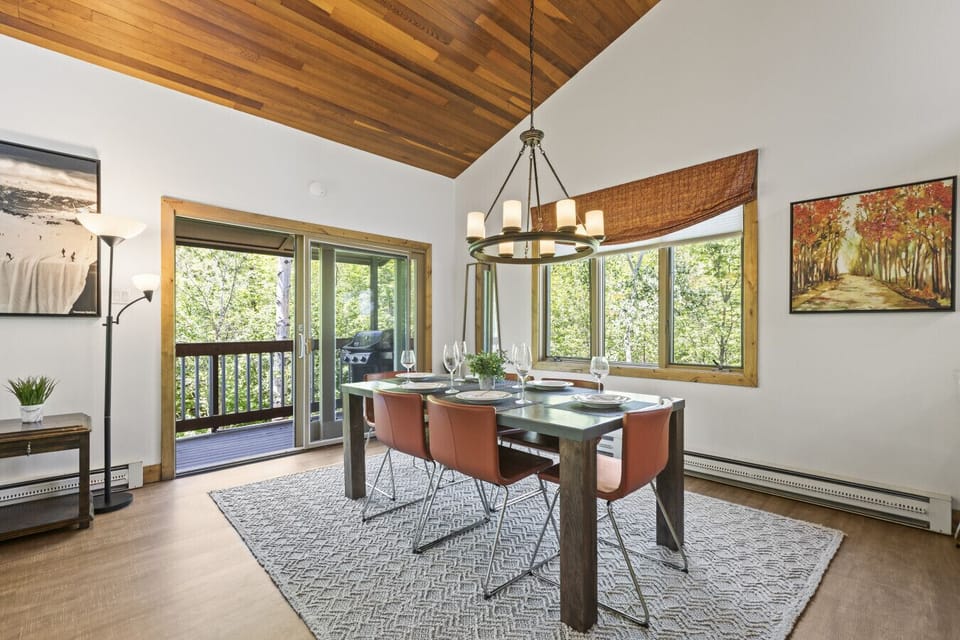 Bright dining area adjacent to the kitchen, ideal for enjoying meals or gathering for game night with friends and family.