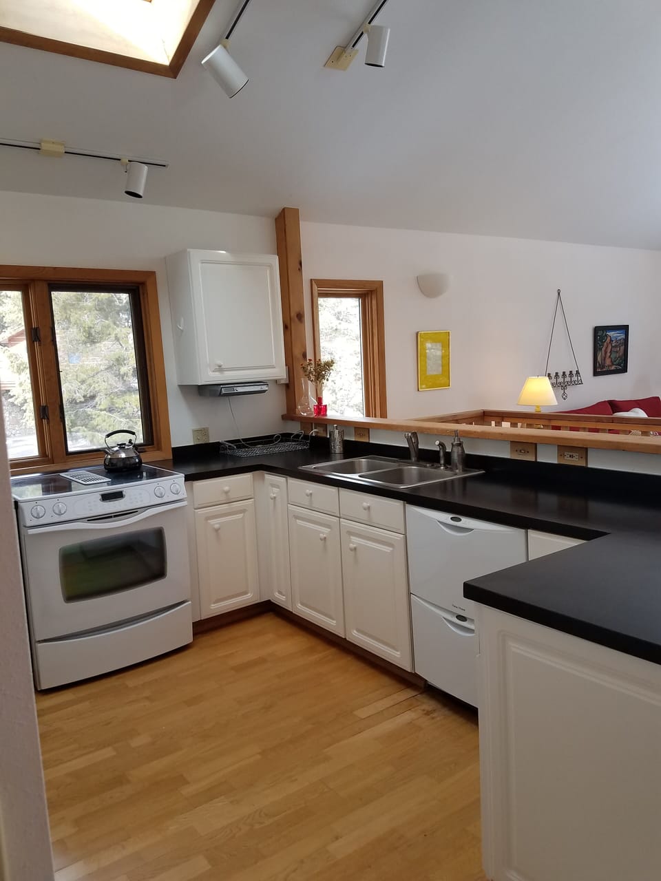 Open kitchen/dining/living area.