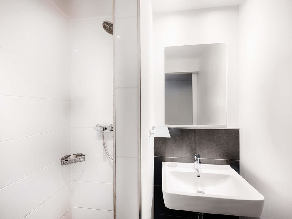 Shower, rainfall showerhead, hair dryer, towels
