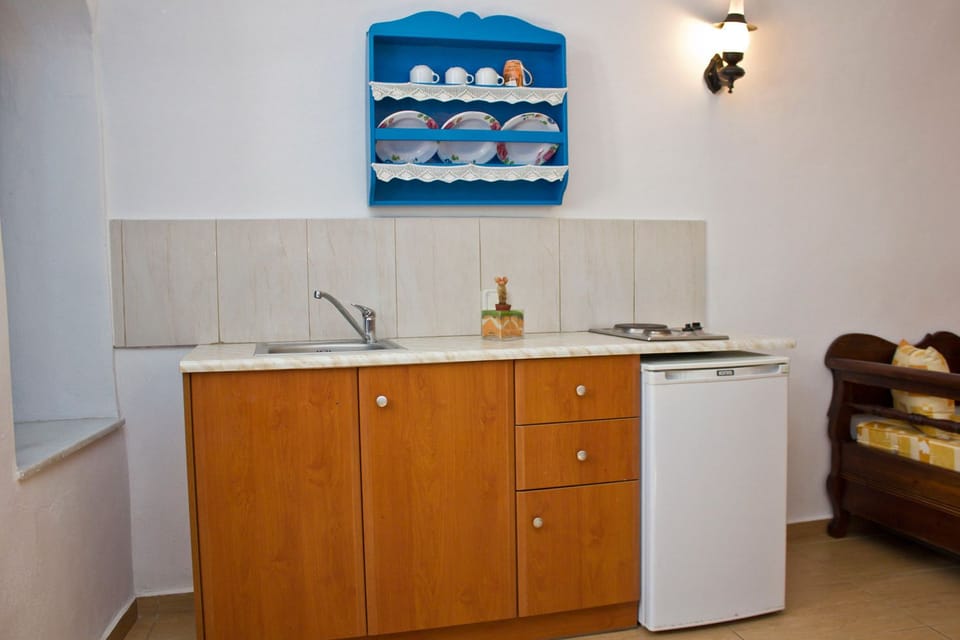 Family Room | Private kitchenette | Fridge