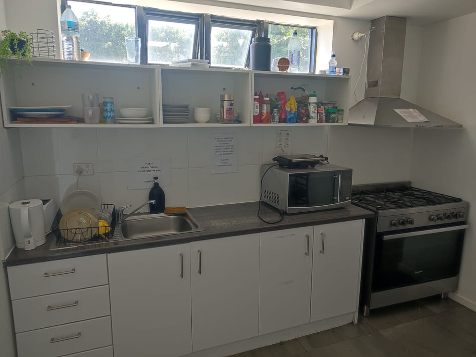 Bed in 10 Bed Mixed Dormitory Room | Private kitchen | Full-size fridge, microwave, oven, stovetop
