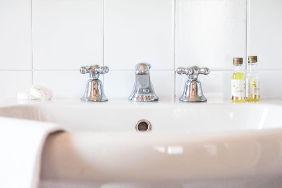 Shower, rainfall showerhead, hair dryer, towels