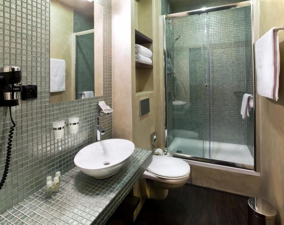 Shower, free toiletries, slippers, towels