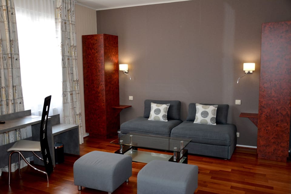 Junior Double Room | Living area | Flat-screen TV