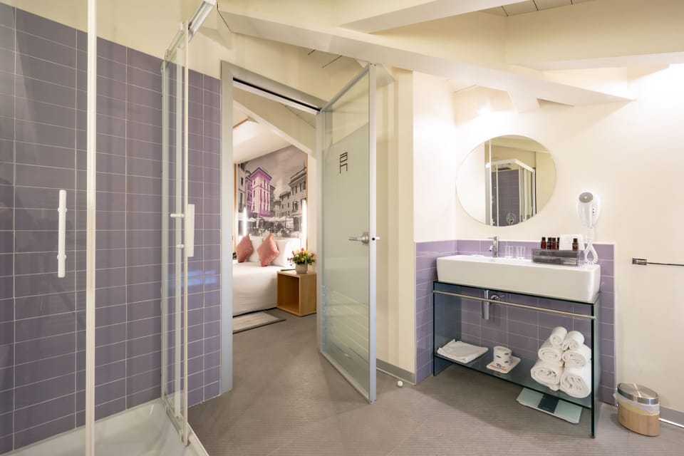 Suite | Bathroom | Rainfall showerhead, free toiletries, hair dryer, bathrobes