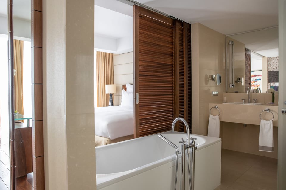 Junior Suite | Bathroom | Separate tub and shower, deep soaking tub, rainfall showerhead