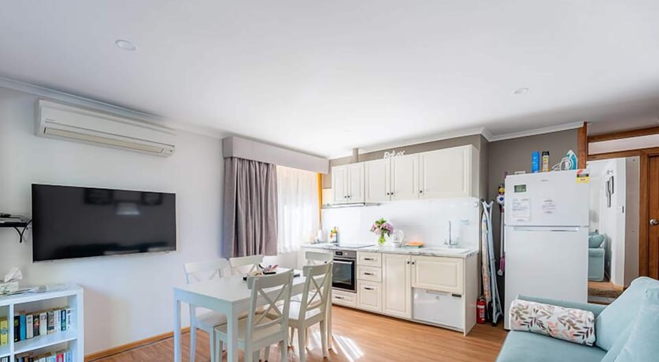 Amble Fern Apartment | Living area | 50-inch Smart TV with digital channels, DVD player