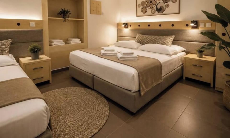 Economy Triple room Ground Floor | Select Comfort beds, minibar, in-room safe, desk