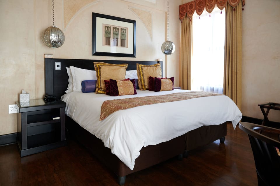 Junior Suite, 1 King Bed | In-room safe, desk, iron/ironing board, free WiFi