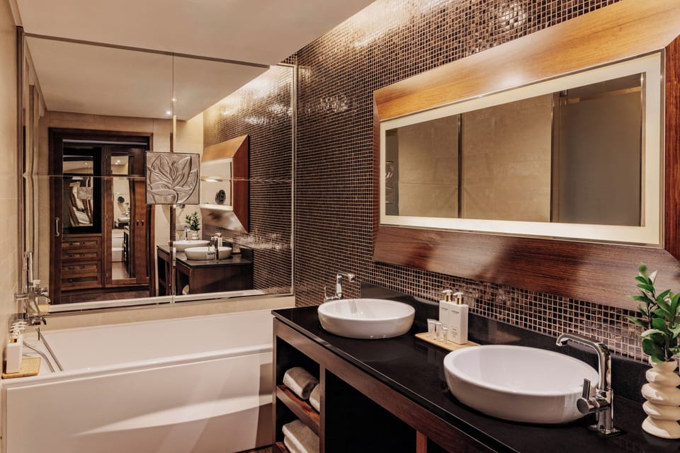 Designer toiletries, hair dryer, bathrobes, slippers