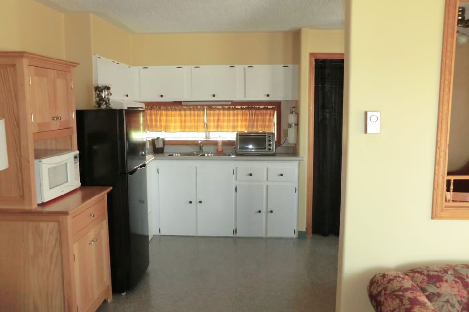 Two Bedroom Cottage - Two Queen Beds and Pull Out Sofa | Private kitchen | Fridge, coffee/tea maker