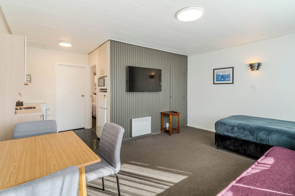 Superior Suite, 1 Bedroom, Kitchen, City View | Living area | 32-inch flat-screen TV with digital channels, TV