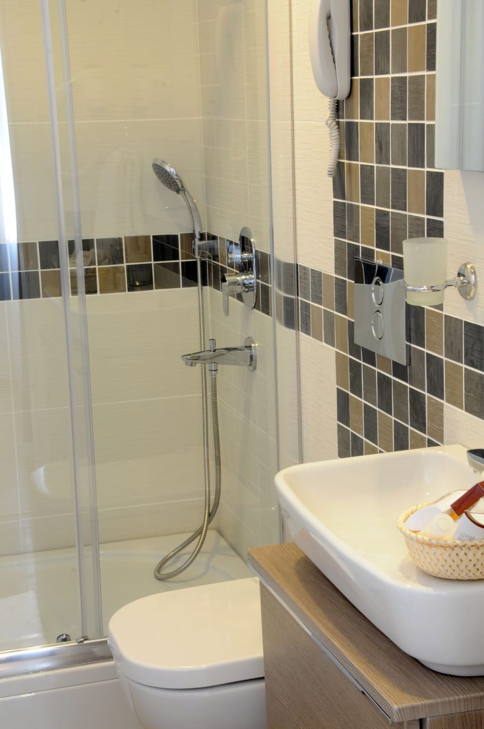 Shower, rainfall showerhead, designer toiletries, hair dryer
