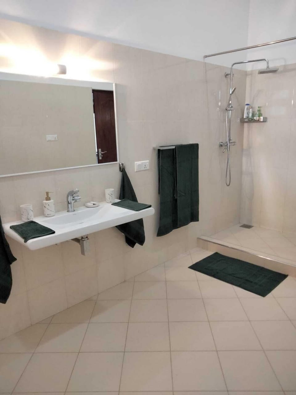 Shower, rainfall showerhead, towels, soap