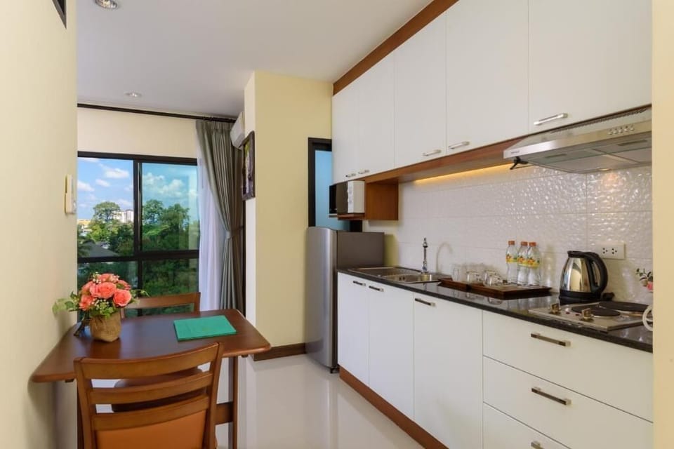 Family Suite Room | Private kitchen | Fridge, electric kettle