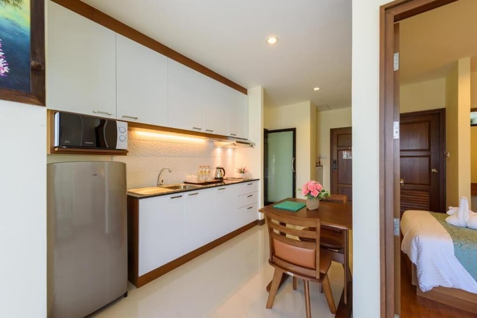 Family Suite Room | Private kitchen | Fridge, electric kettle
