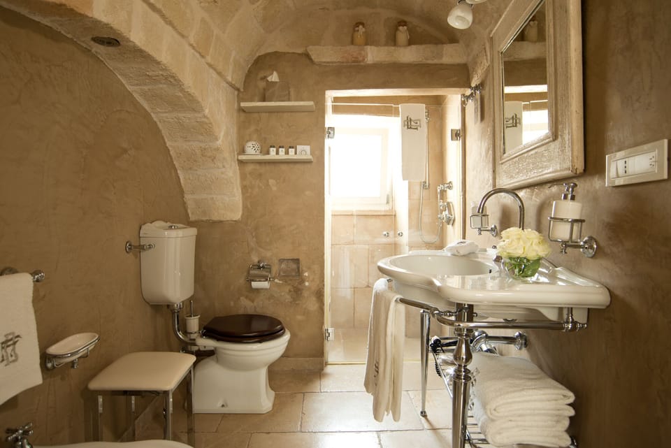 Deluxe Room, Ground Floor | Bathroom | Shower, designer toiletries, hair dryer, bathrobes