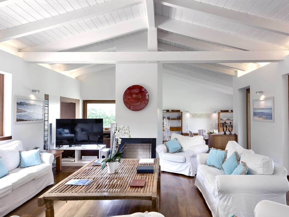 Luxury Villa, Sea View | Living area | 32-inch TV with satellite channels