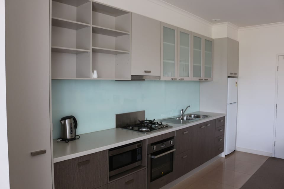  Two Bedroom Townhouse | Private kitchen | Full-size fridge, microwave, espresso maker, coffee/tea maker