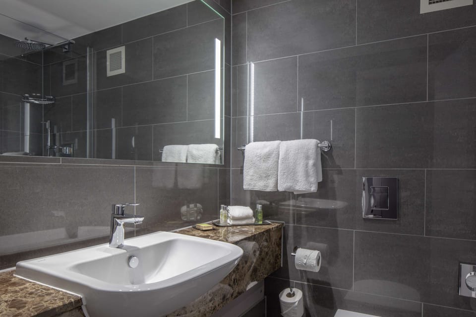 Rainfall showerhead, designer toiletries, hair dryer, towels