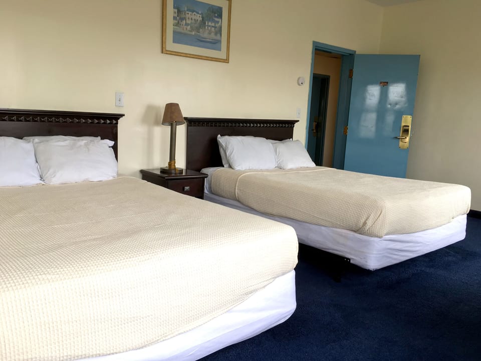 Standard Room, 2 Double Beds | Desk, WiFi (free), individually furnished, bed sheets