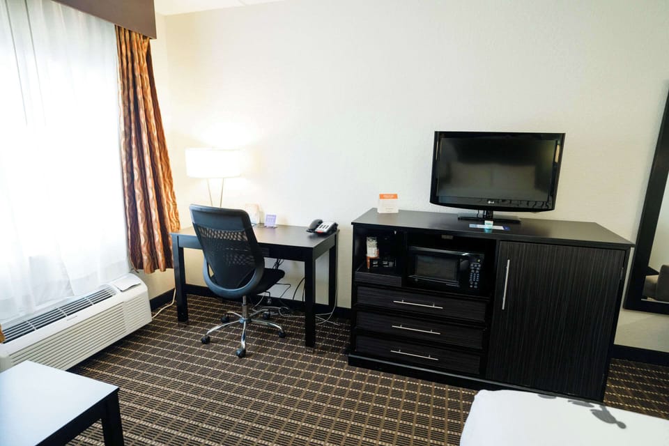 Desk, blackout drapes, iron/ironing board, free cribs/infant beds