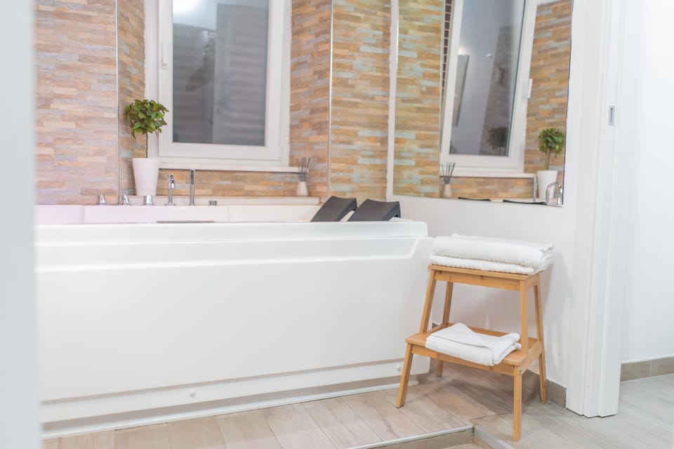 Superior Double Room, Jetted Tub (iZen) | Bathroom | Hair dryer, bathrobes, slippers, towels