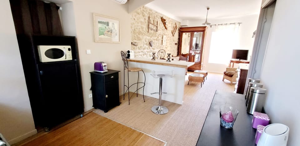 Family Apartment, Kitchenette, Pool View | Living area | 60-cm TV with digital channels