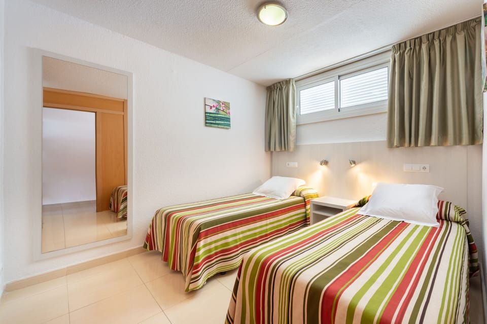 Apartment, 1 Bedroom, Balcony, Partial Sea View | 1 bedroom, in-room safe, desk, blackout drapes