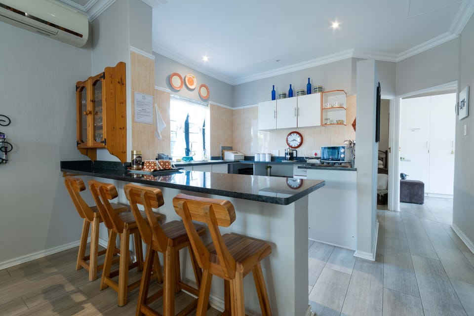 Gratia Apartment 1 | Private kitchen | Full-size fridge, microwave, cookware/dishes/utensils, dining tables