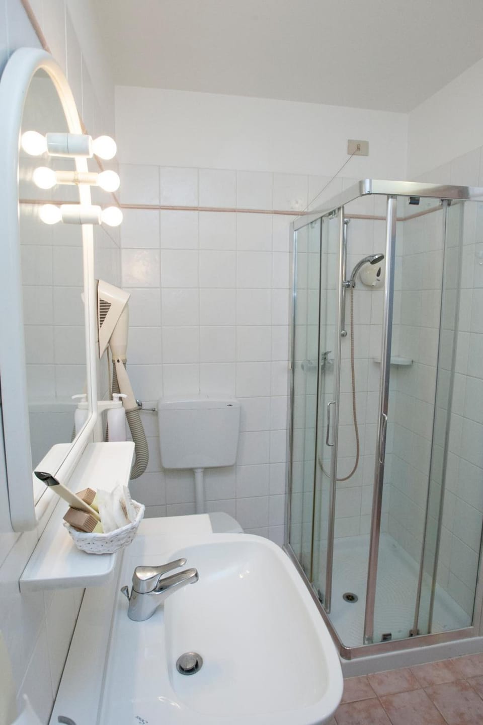 Bathtub, hair dryer, slippers, towels