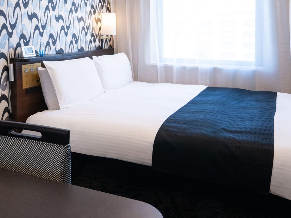 Down comforters, desk, blackout drapes, iron/ironing board