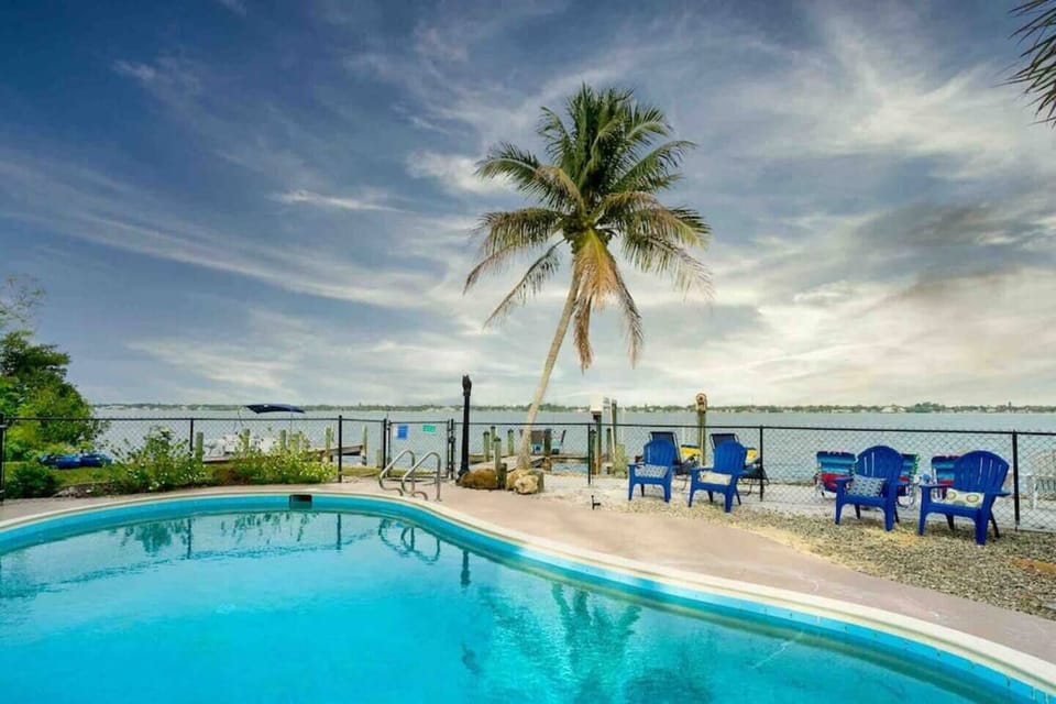 Inviting tropical pool overlooks stunning Lemon Bay
