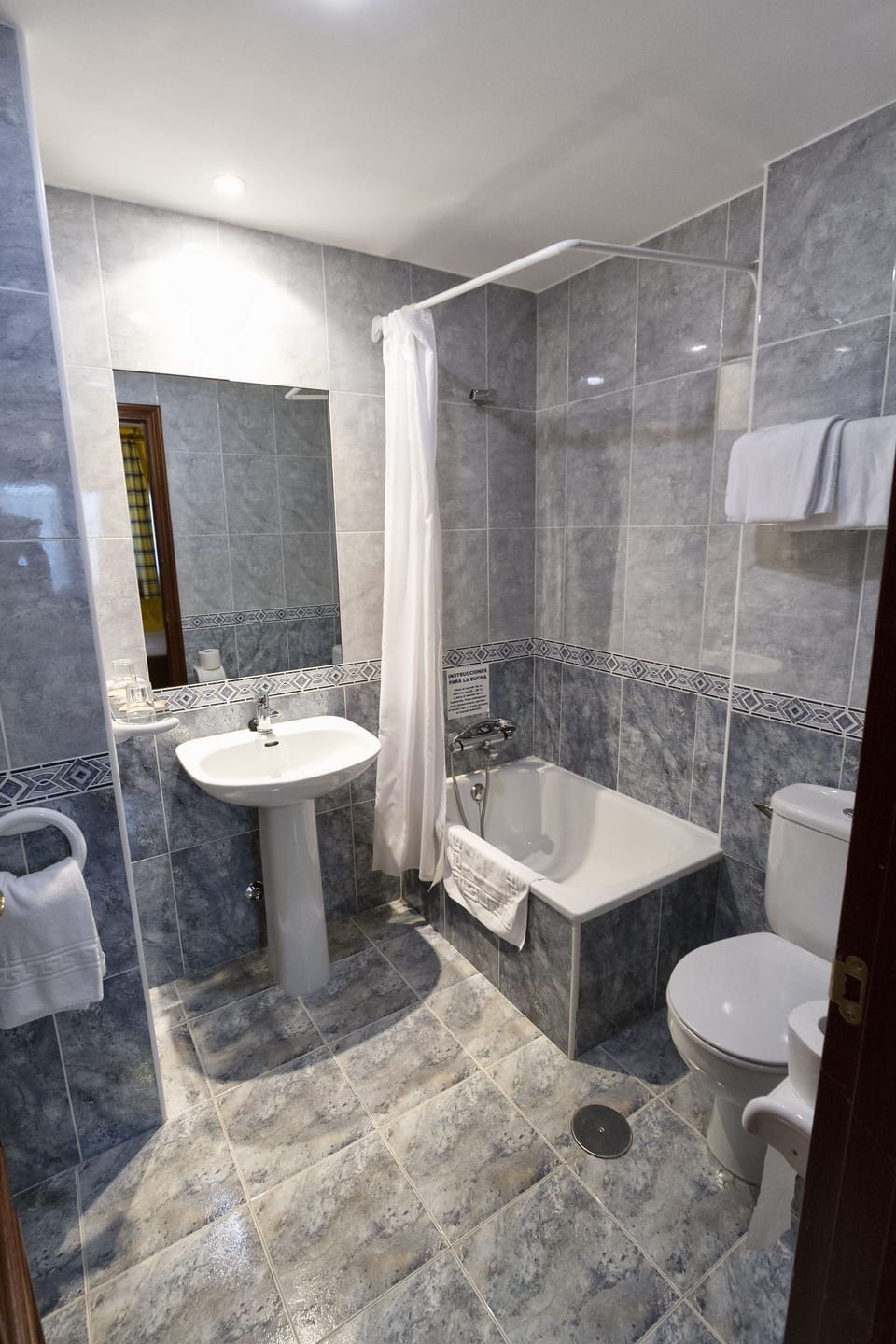 Shower, hair dryer, towels, toilet paper