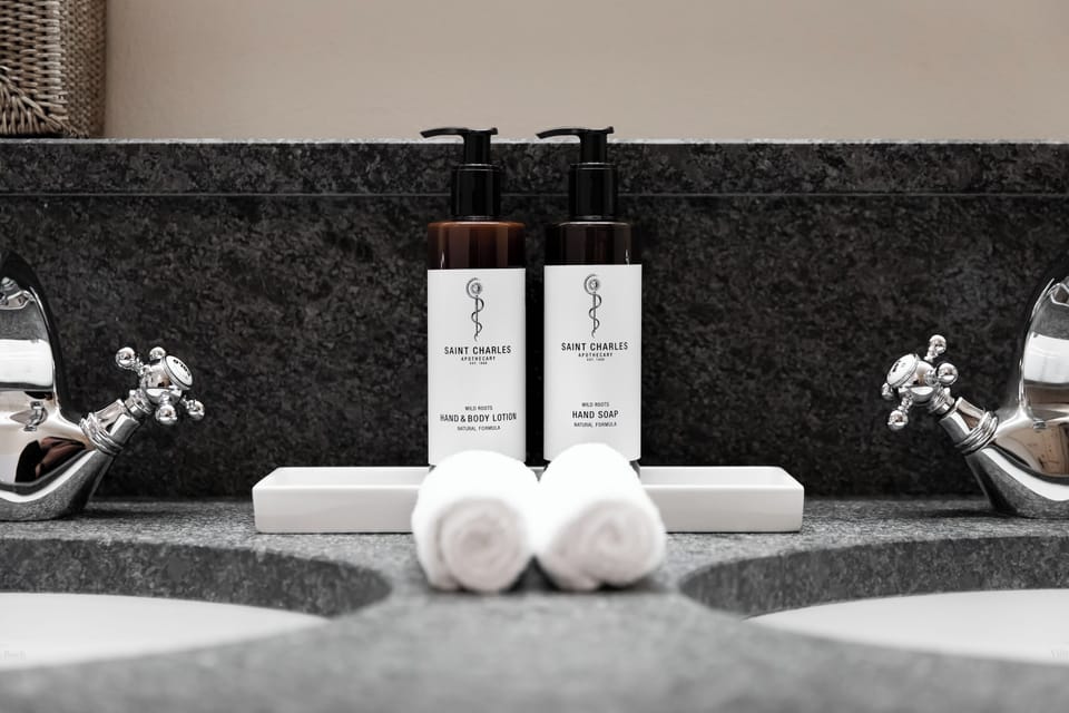Separate tub and shower, rainfall showerhead, hair dryer, bathrobes