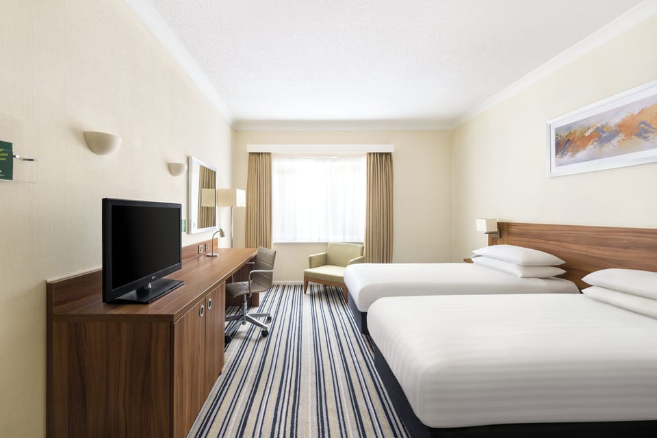 Desk, blackout drapes, iron/ironing board, free cribs/infant beds