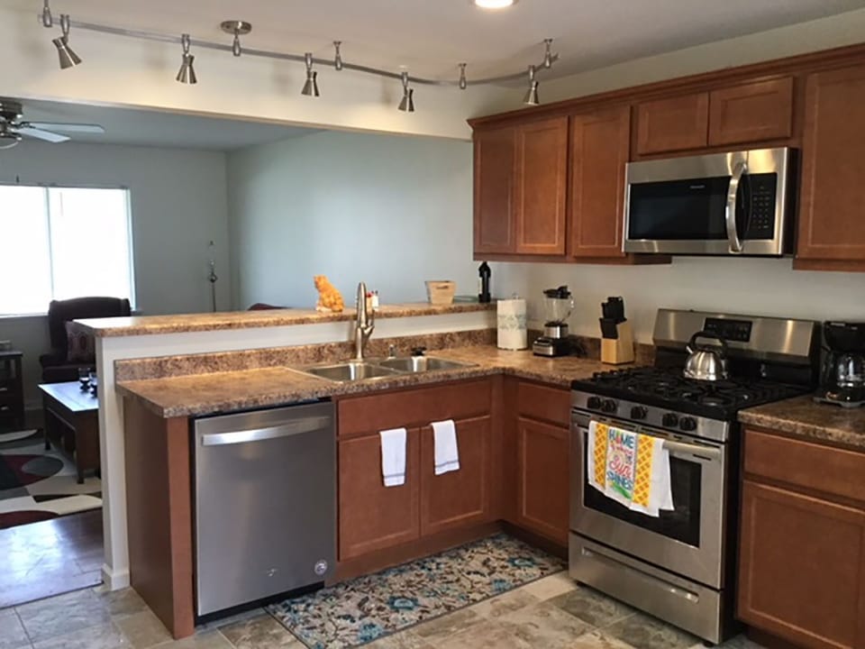 New Stainless Programmable Microwave, Dishwasher and Gas Range. 