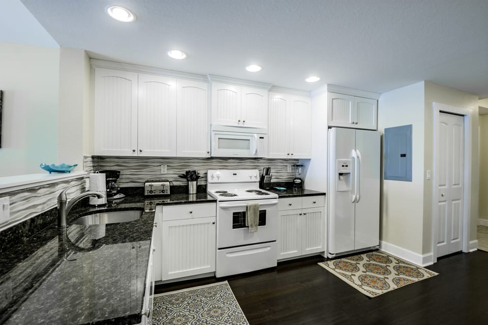 Fully stocked kitchen includes a Mr. Coffee and Keurig