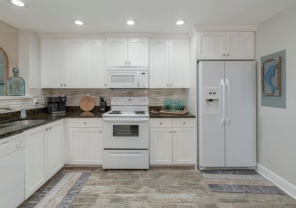 Another view of the unit's full equipped kitchen