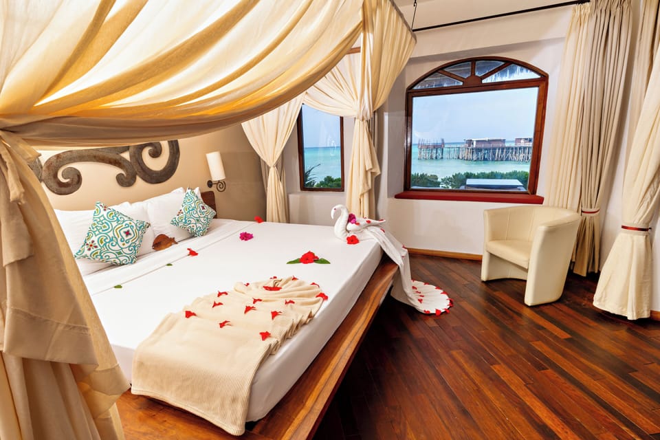Seafront Suite | Premium bedding, minibar, in-room safe, individually decorated