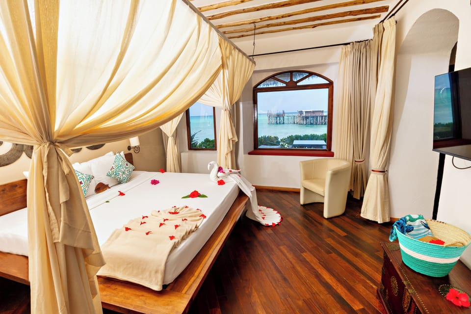 Seafront Suite | Premium bedding, minibar, in-room safe, individually decorated