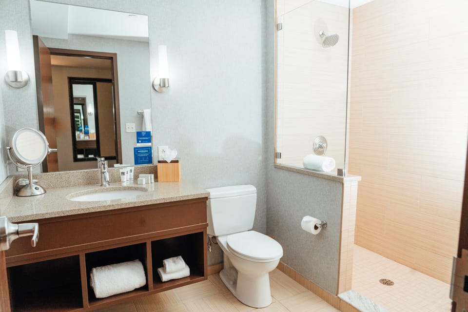 Shower, rainfall showerhead, designer toiletries, hair dryer