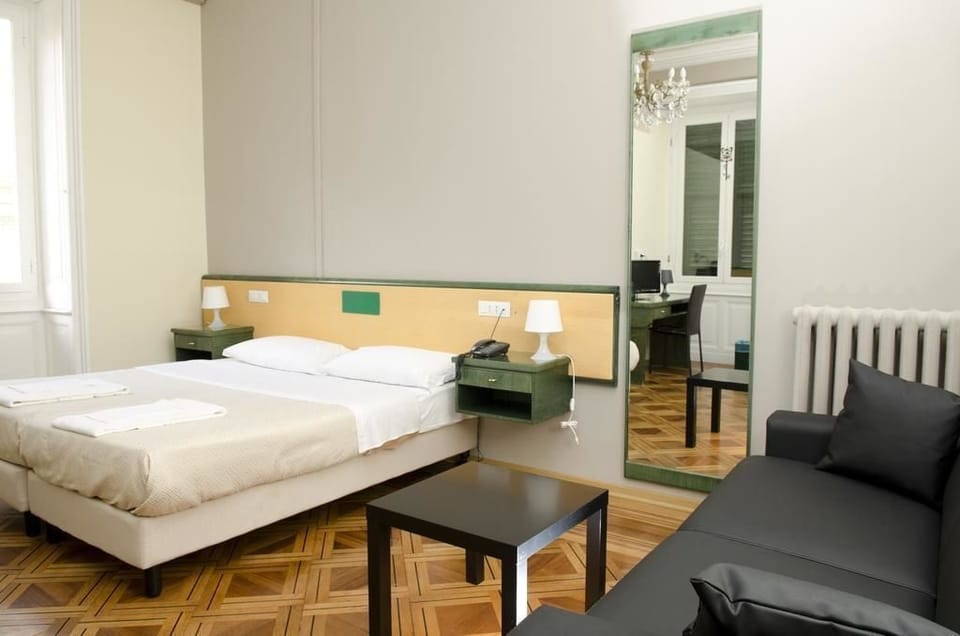 Quadruple Room | Living area | 22-inch LCD TV with digital channels, TV